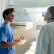 Nurse and doctor talking in hospital