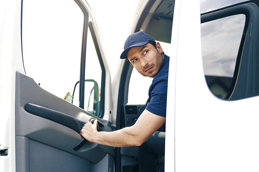 Driver backing up van