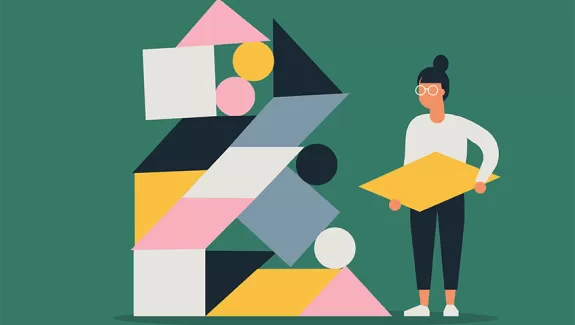 Woman holding missing piece of structure.