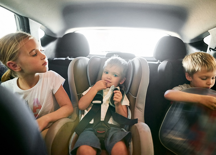 Happy children in a car