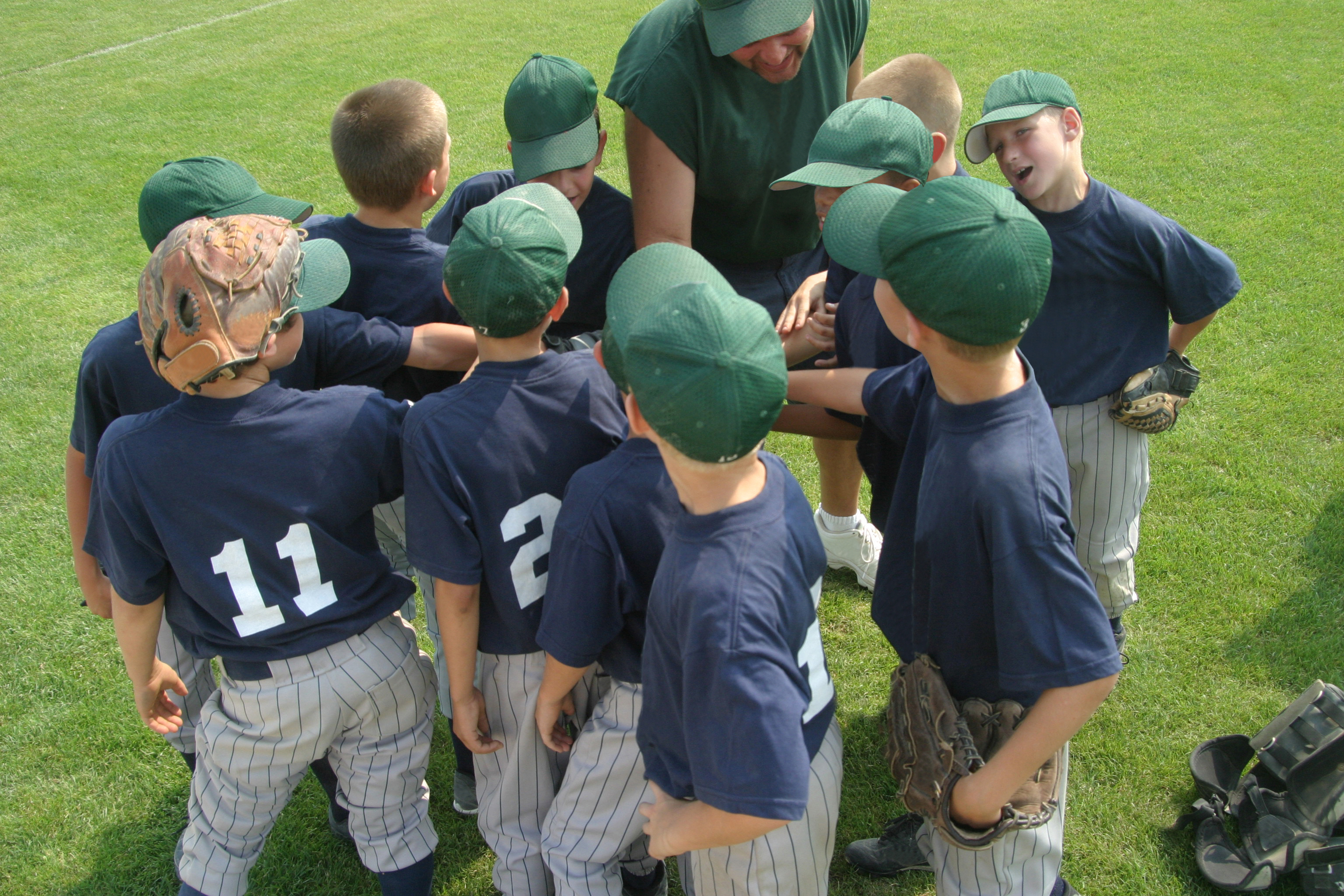 Joannes son's baseball team in a huddle