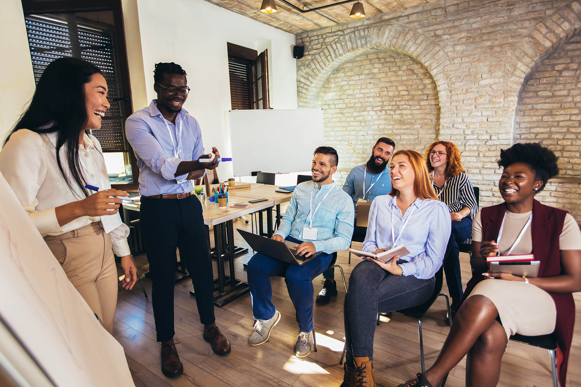 Two people hosting a training in the workplace