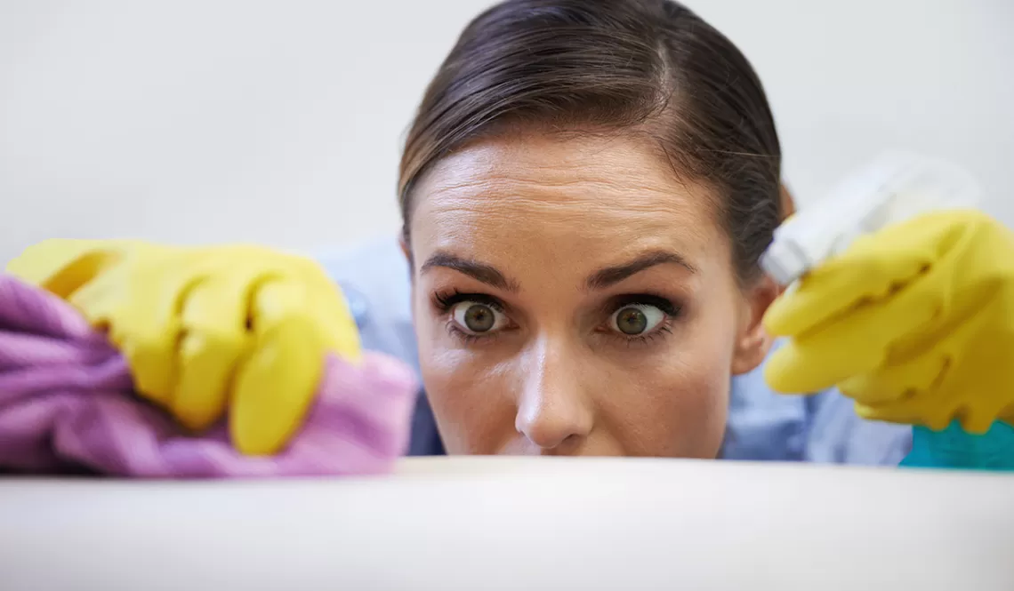 Woman Cleaning Looking Frantic
