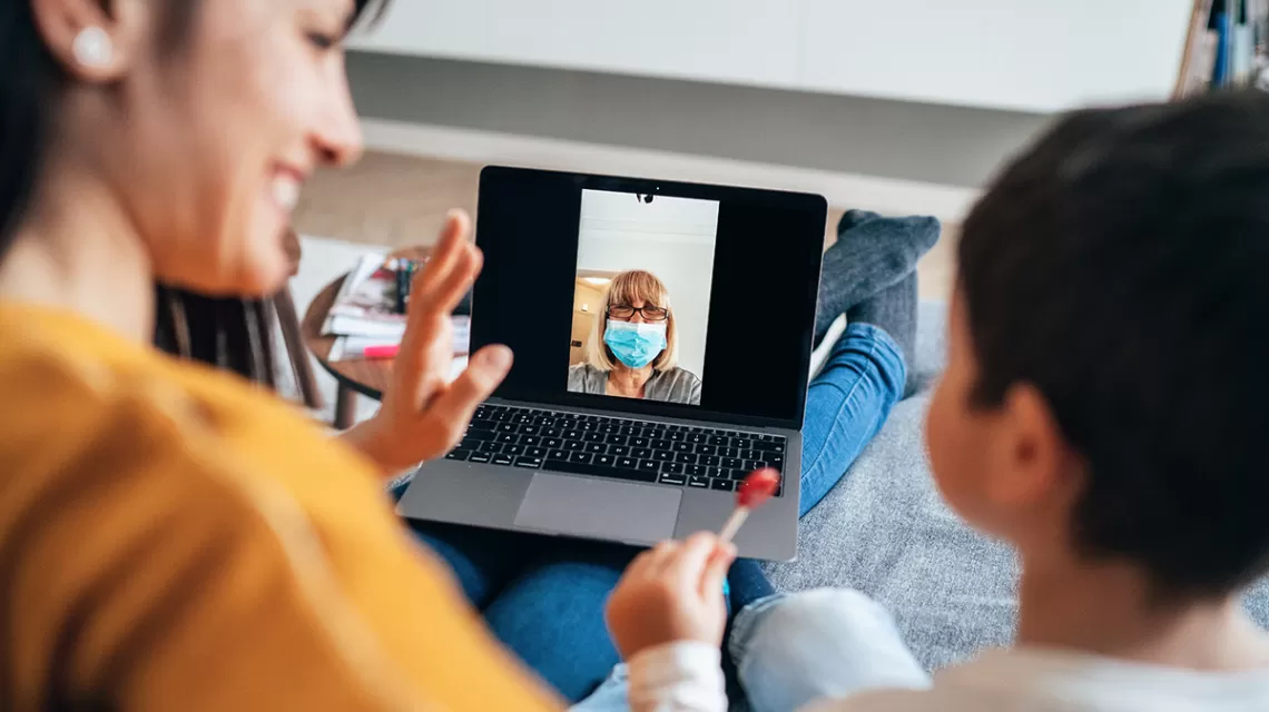 Woman and child having a virtual meet 