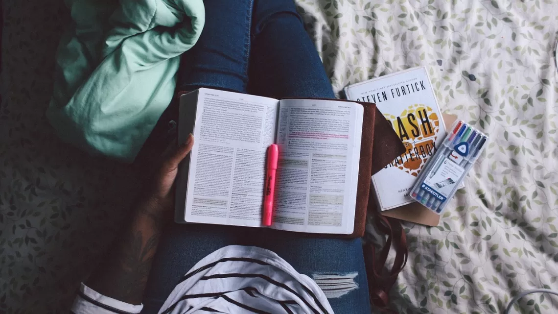 Student with Book on lap