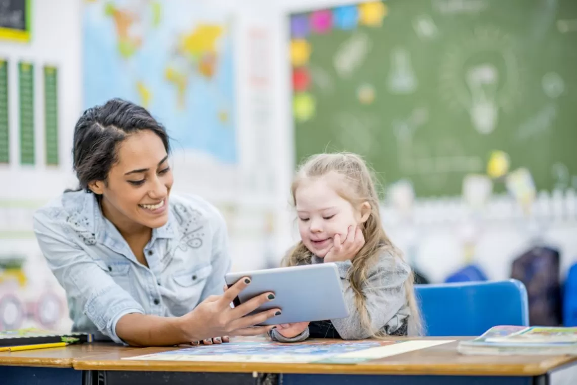 A teacher working with a child