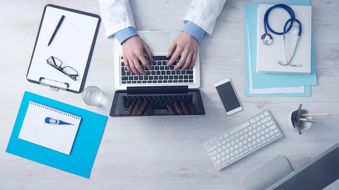 Medical office desk with laptop