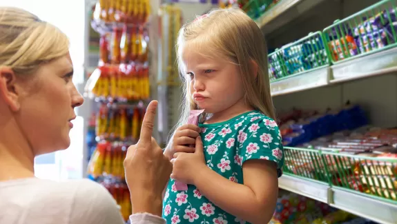 Woman Scolding Child in Store