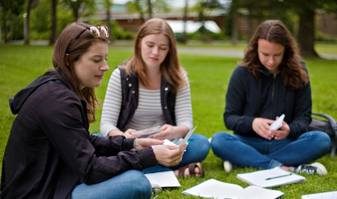 Students using flashcards to study for the BCBA® Exam