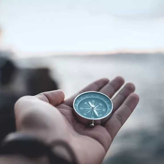 Sailor holding a compass